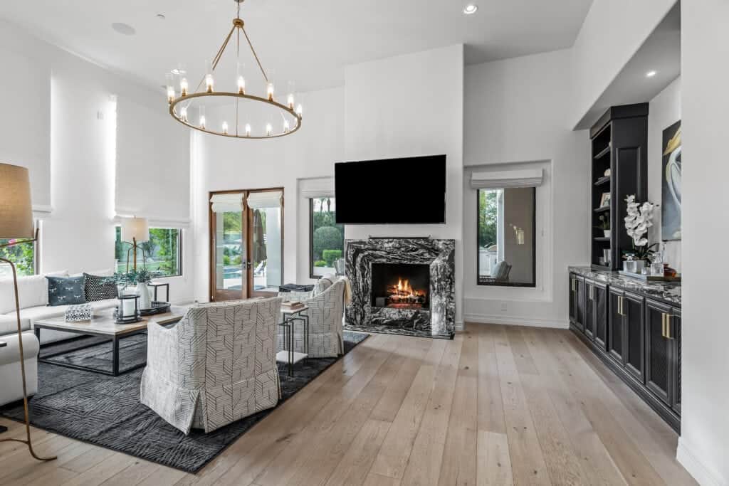 Modern living room interior with marble fireplace and contemporary furniture, inspired by Meredith Lane design.